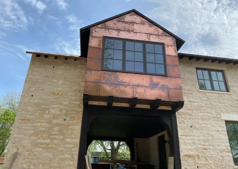 Copper metal panel facade on a stone building for Skylight Installation in Apple Valley